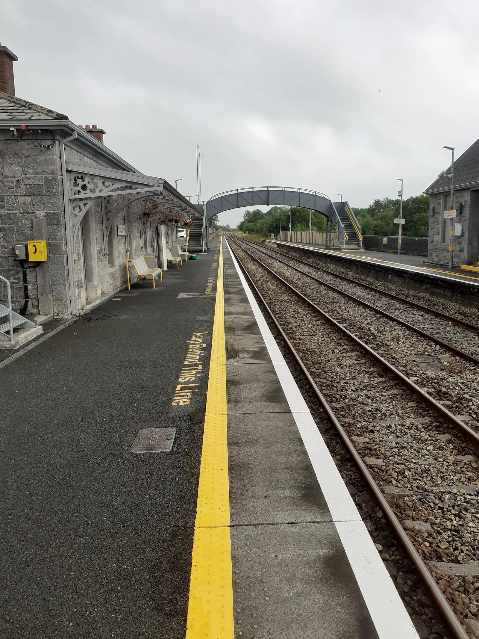 The platform at Castlerea looking along the track, empty, with the yellow safety line.